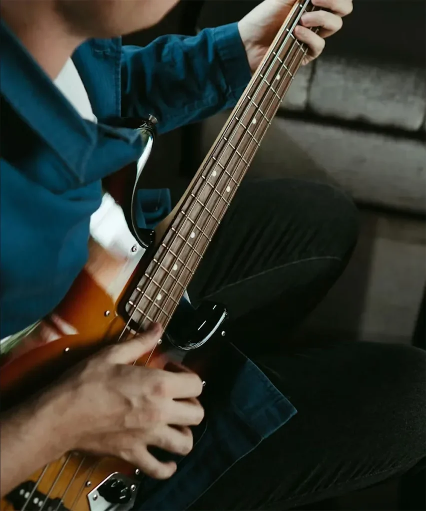 A musician playing bass guitar