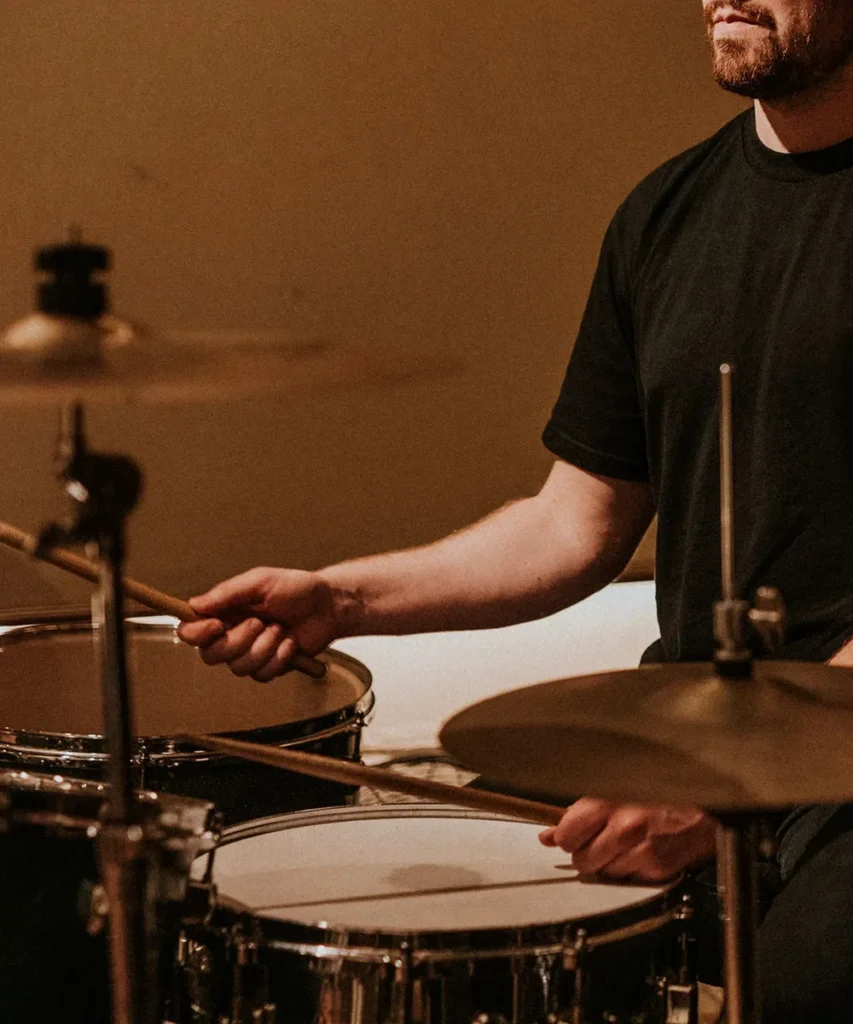 A drummer playing a drum kit